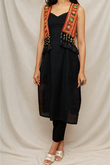 Model wearing the Anaykaa Zariya Kutchi Mirrorwork Jacket Kurta Set in premium black Cotton featuring a handcrafted Kutchi mirrorwork embroidered jacket with tassels and matching straight pants.