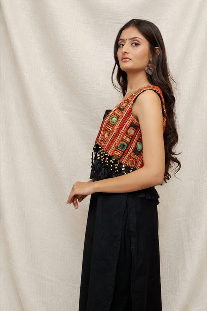 Model wearing the Anaykaa Zariya Kutchi Mirrorwork Jacket Kurta Set in premium black Cotton featuring a handcrafted Kutchi mirrorwork embroidered jacket with tassels and matching straight pants.